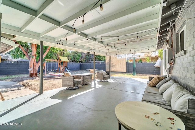 view of patio / terrace featuring an outdoor living space and a playground