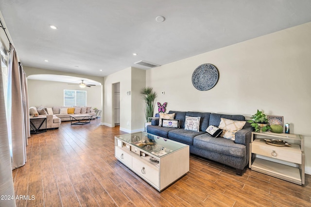 living room with hardwood / wood-style flooring and ceiling fan