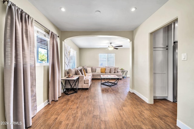 living room with hardwood / wood-style floors and ceiling fan