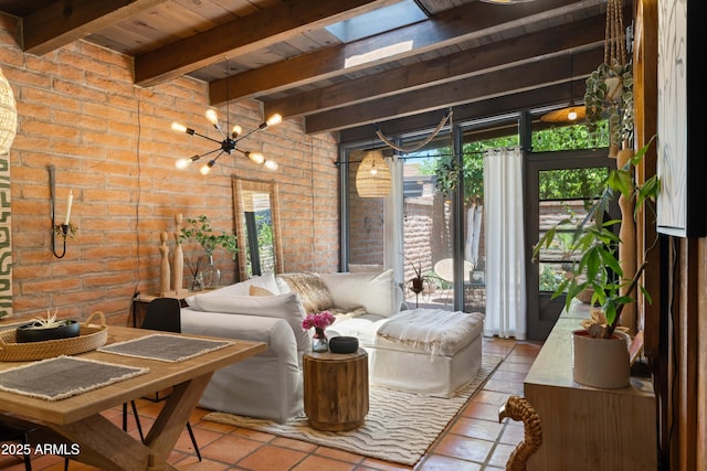 3032 N 32nd St Unit 61, Phoenix, AZ 85018 - tiled living room featuring brick wall, a wood ceiling with exposed beams, a chandelier, and a skylight