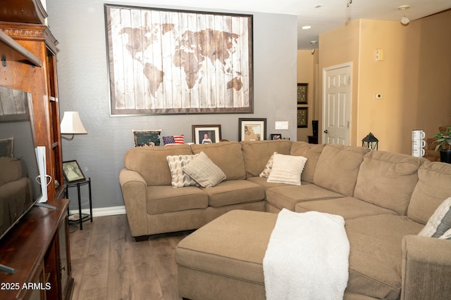 living room featuring dark wood-style floors and baseboards