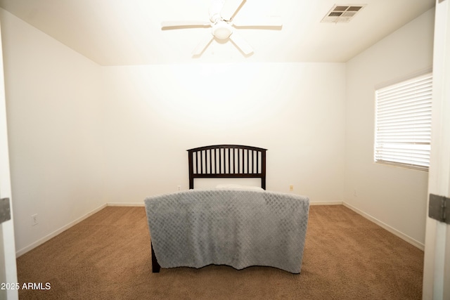 bedroom with a ceiling fan, light carpet, visible vents, and baseboards