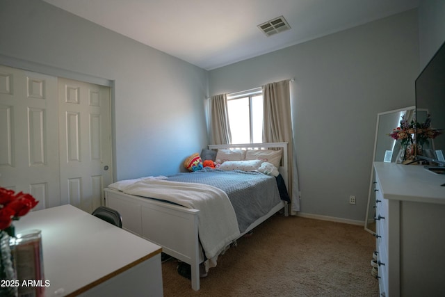 bedroom with baseboards, visible vents, and light colored carpet