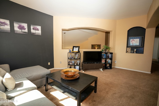 living room featuring carpet floors and baseboards