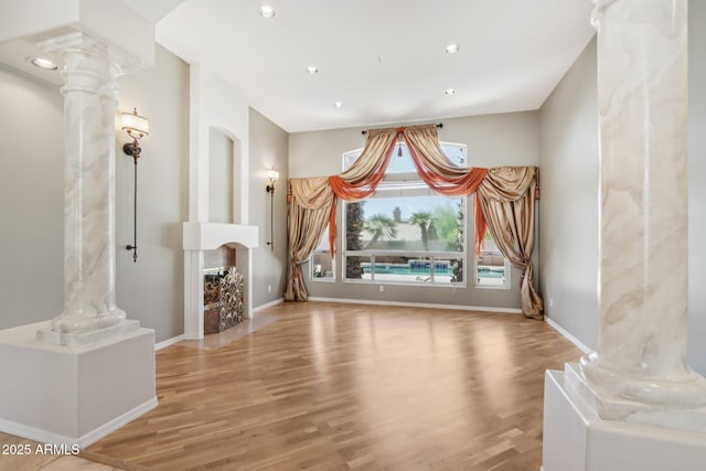 12183 E Mercer Ln, Scottsdale, AZ 85259 - interior space with decorative columns, wood finished floors, baseboards, and recessed lighting