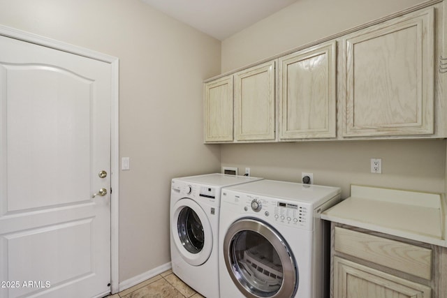 12183 E Mercer Ln, Scottsdale, AZ 85259 - laundry area with cabinet space, baseboards, independent washer and dryer, and light tile patterned floors