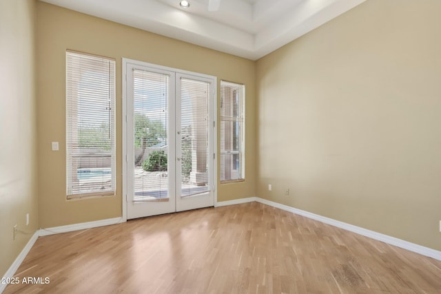12183 E Mercer Ln, Scottsdale, AZ 85259 - entryway with light wood-style floors, baseboards, and french doors