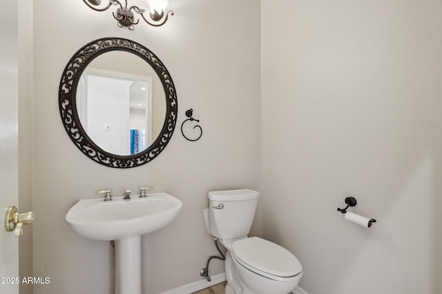12183 E Mercer Ln, Scottsdale, AZ 85259 - bathroom featuring toilet and baseboards