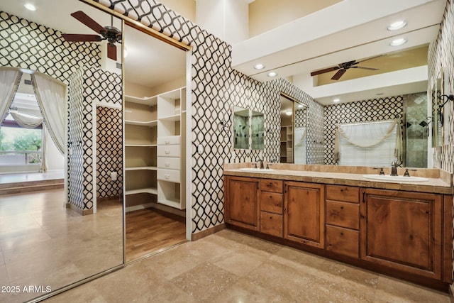 12183 E Mercer Ln, Scottsdale, AZ 85259 - full bathroom with a ceiling fan, double vanity, a walk in closet, recessed lighting, and wallpapered walls