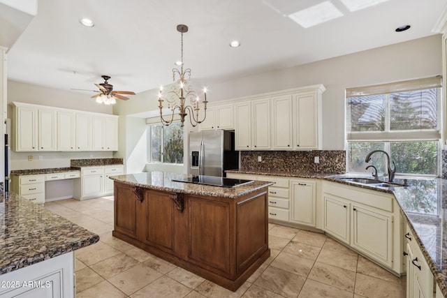 12183 E Mercer Ln, Scottsdale, AZ 85259 - kitchen with a sink, stainless steel fridge, plenty of natural light, black electric cooktop, and recessed lighting
