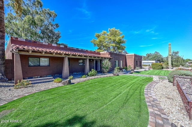 view of front of home with a front yard