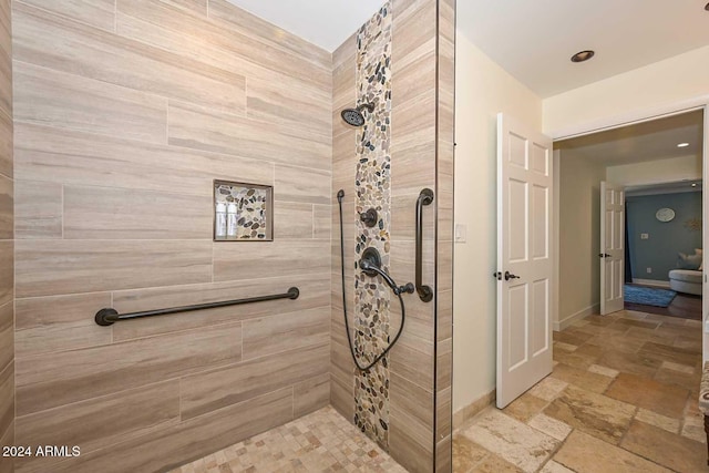 bathroom with a tile shower