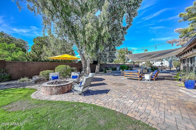 view of patio with an outdoor fire pit