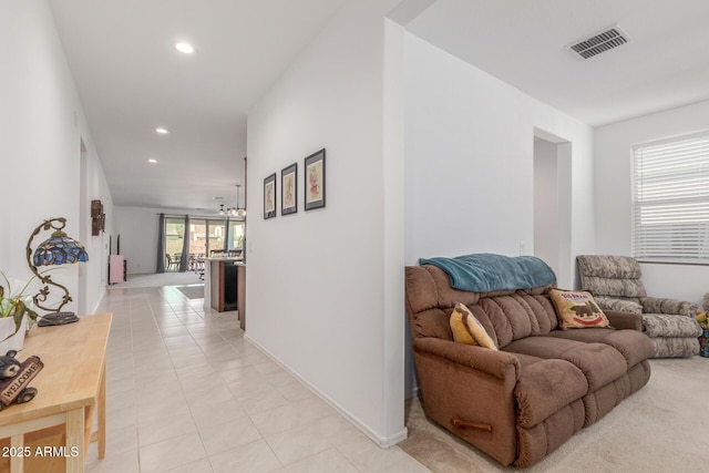 hall featuring light tile patterned flooring