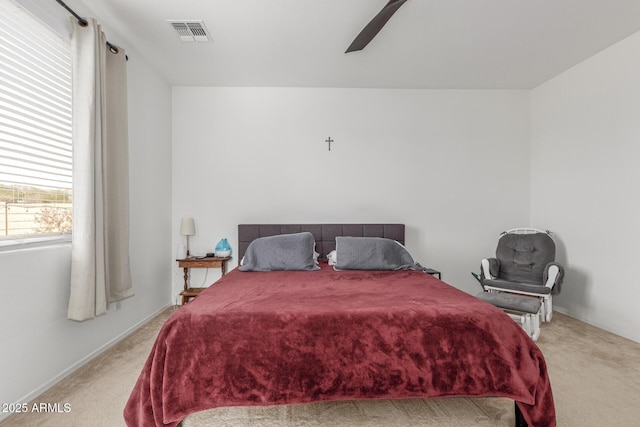 bedroom featuring ceiling fan and light colored carpet