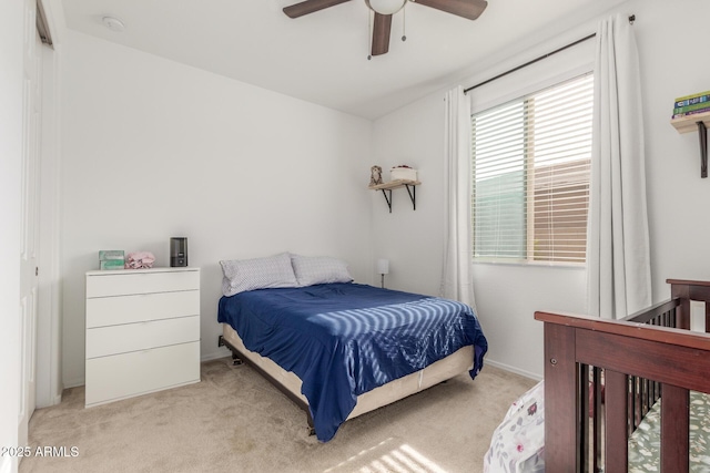 bedroom with light carpet and ceiling fan