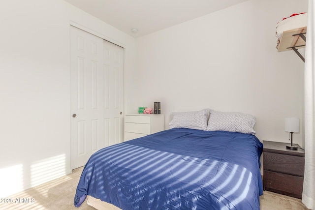 carpeted bedroom featuring a closet