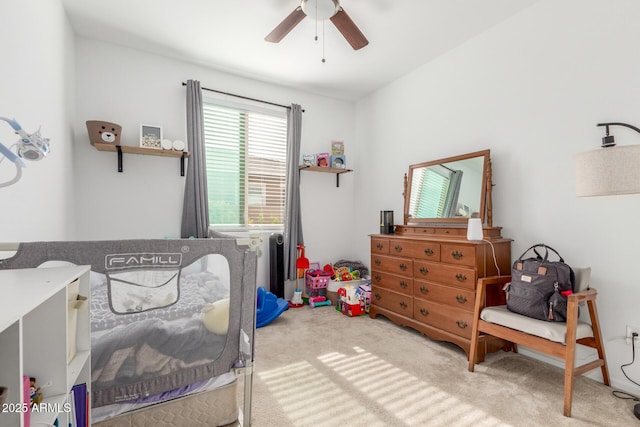 carpeted bedroom with ceiling fan