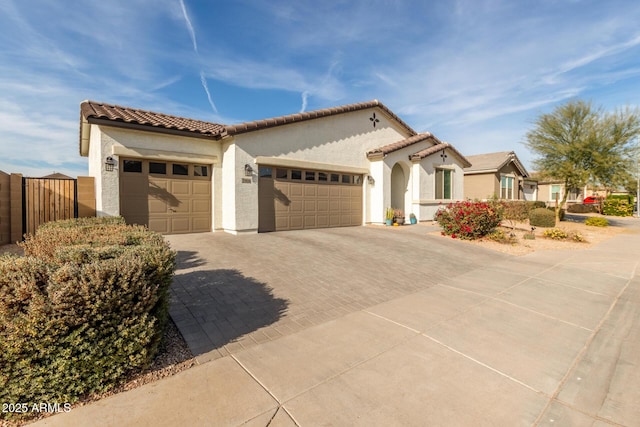 mediterranean / spanish house featuring a garage