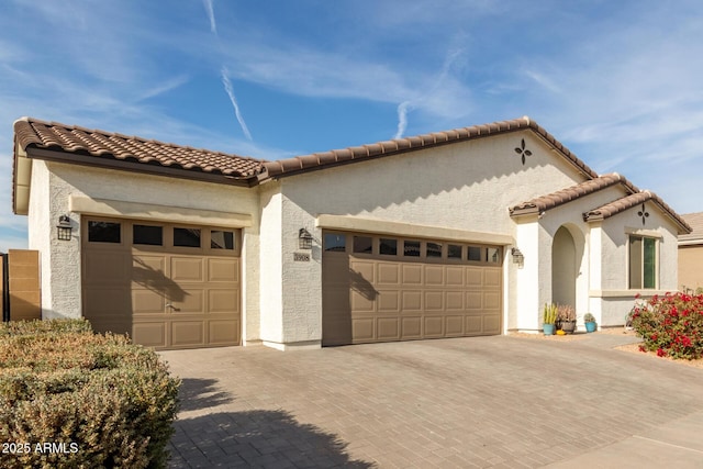 mediterranean / spanish-style house featuring a garage