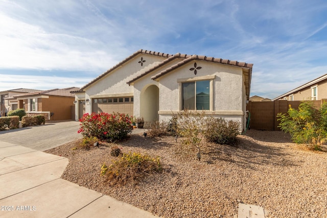 mediterranean / spanish-style home featuring a garage