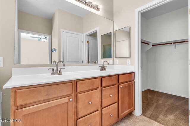 209 E Diamond Trl, San Tan Valley, AZ 85143 - bathroom with double vanity, ceiling fan, and a walk in closet