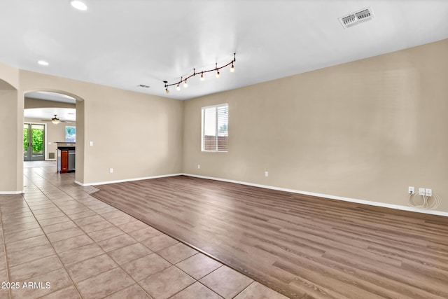 209 E Diamond Trl, San Tan Valley, AZ 85143 - unfurnished room with recessed lighting, arched walkways, baseboards, a ceiling fan, and light wood finished floors