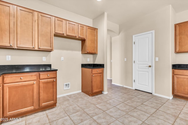 209 E Diamond Trl, San Tan Valley, AZ 85143 - kitchen featuring light tile patterned floors, baseboards, and brown cabinets