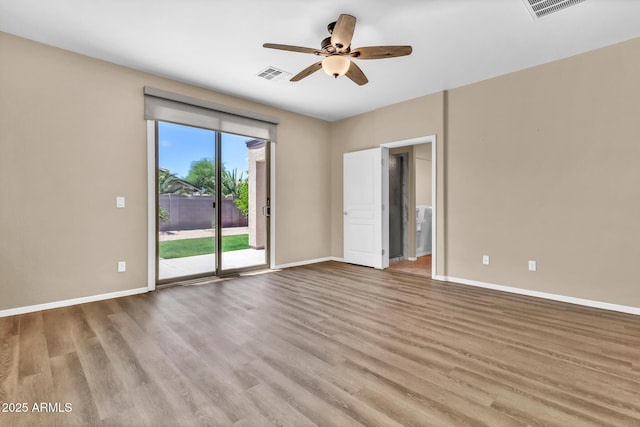 209 E Diamond Trl, San Tan Valley, AZ 85143 - spare room with ceiling fan, wood finished floors, and baseboards