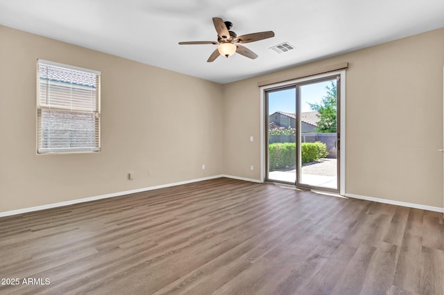 209 E Diamond Trl, San Tan Valley, AZ 85143 - spare room featuring wood finished floors, baseboards, and ceiling fan