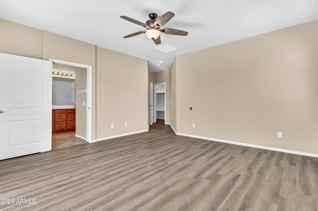 209 E Diamond Trl, San Tan Valley, AZ 85143 - unfurnished bedroom featuring light wood finished floors, baseboards, ensuite bathroom, and ceiling fan