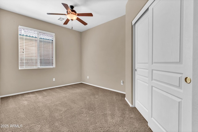 209 E Diamond Trl, San Tan Valley, AZ 85143 - unfurnished bedroom featuring baseboards, carpet floors, a closet, and a ceiling fan