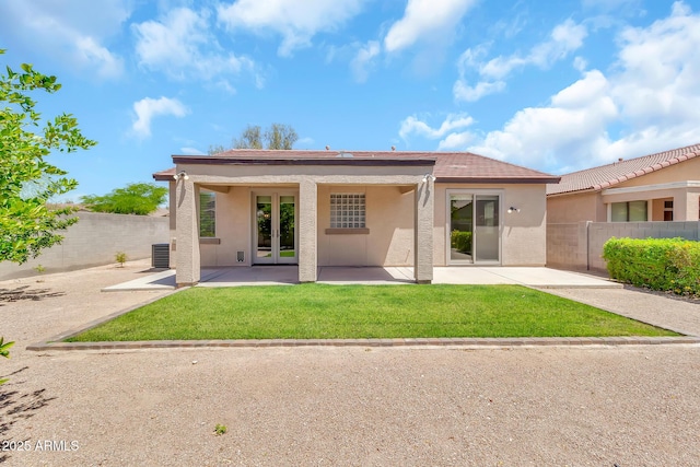 209 E Diamond Trl, San Tan Valley, AZ 85143 - back of property featuring central AC unit, french doors, stucco siding, and a patio area
