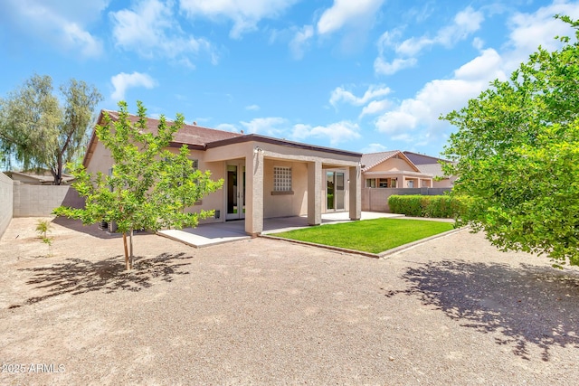 209 E Diamond Trl, San Tan Valley, AZ 85143 - back of house with a patio area, stucco siding, and a fenced backyard