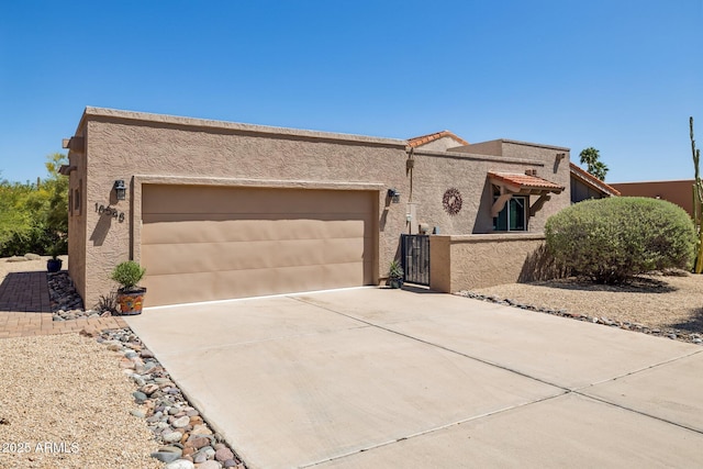 18548 E Parada Cir, Rio Verde, AZ 85263 - view of front of property featuring a garage, driveway, stucco siding, and a tiled roof