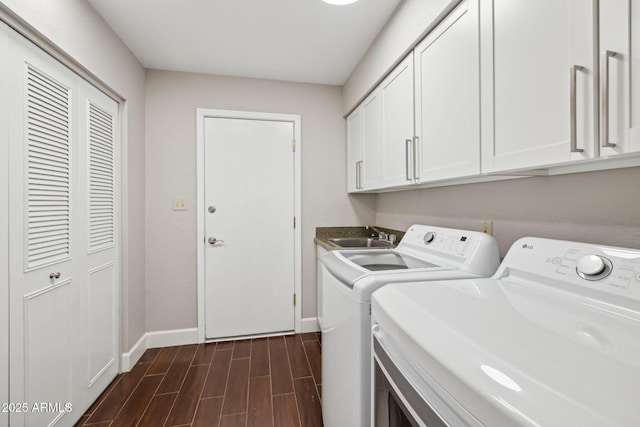 18548 E Parada Cir, Rio Verde, AZ 85263 - laundry room with baseboards, a sink, dark wood finished floors, cabinet space, and washer and clothes dryer