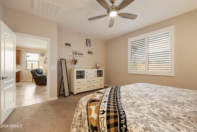 carpeted bedroom with ceiling fan