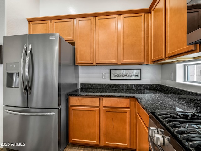 7648 S Thimble Peak, Gold Canyon, AZ 85118 - kitchen featuring stainless steel appliances, dark stone counters, and brown cabinetry