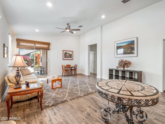 7648 S Thimble Peak, Gold Canyon, AZ 85118 - living area featuring lofted ceiling, recessed lighting, ceiling fan, wood finished floors, and baseboards