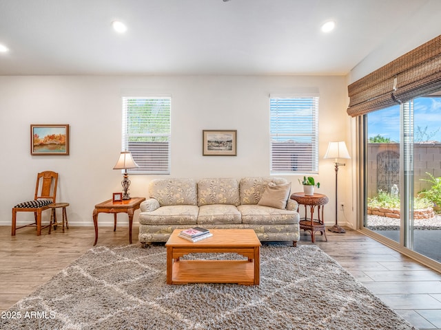 7648 S Thimble Peak, Gold Canyon, AZ 85118 - living area featuring healthy amount of natural light, recessed lighting, wood finished floors, and baseboards