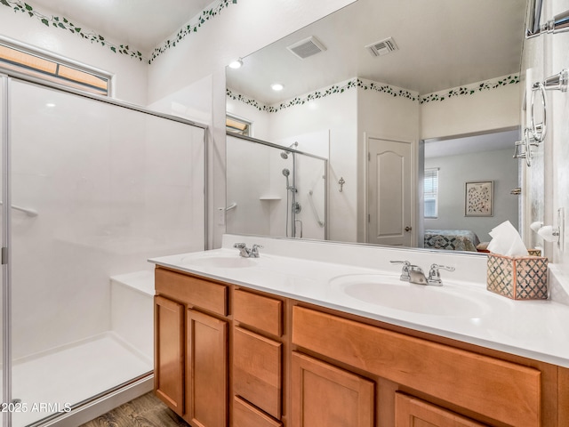 7648 S Thimble Peak, Gold Canyon, AZ 85118 - ensuite bathroom featuring a stall shower, double vanity, and wood finished floors
