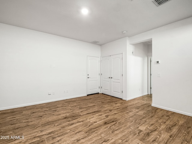 7648 S Thimble Peak, Gold Canyon, AZ 85118 - empty room with wood finished floors and baseboards