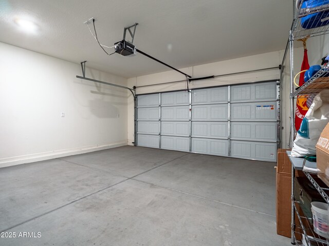 7648 S Thimble Peak, Gold Canyon, AZ 85118 - garage featuring a garage door opener and baseboards