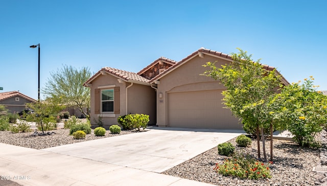 7648 S Thimble Peak, Gold Canyon, AZ 85118 - view of front of property with a garage, concrete driveway, stucco siding, and a tiled roof