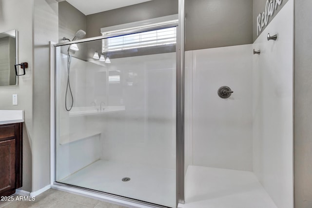 full bathroom featuring a shower stall and vanity