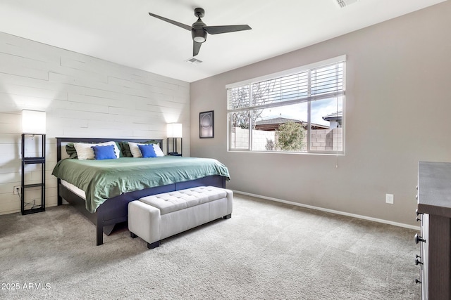 bedroom featuring visible vents, baseboards, ceiling fan, and carpet flooring