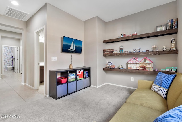 interior space featuring tile patterned floors, visible vents, baseboards, and carpet floors