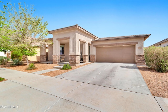 prairie-style home with brick siding, stucco siding, an attached garage, and concrete driveway