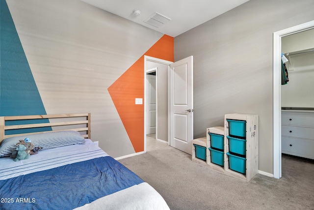 bedroom with visible vents, baseboards, and carpet