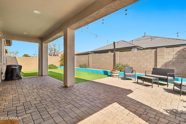 view of patio / terrace with outdoor lounge area and a fenced backyard